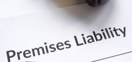 a gavel and pen resting on a document titled 'Premises Liability'