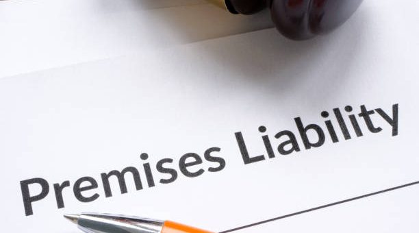 a gavel and pen resting on a document titled 'Premises Liability'