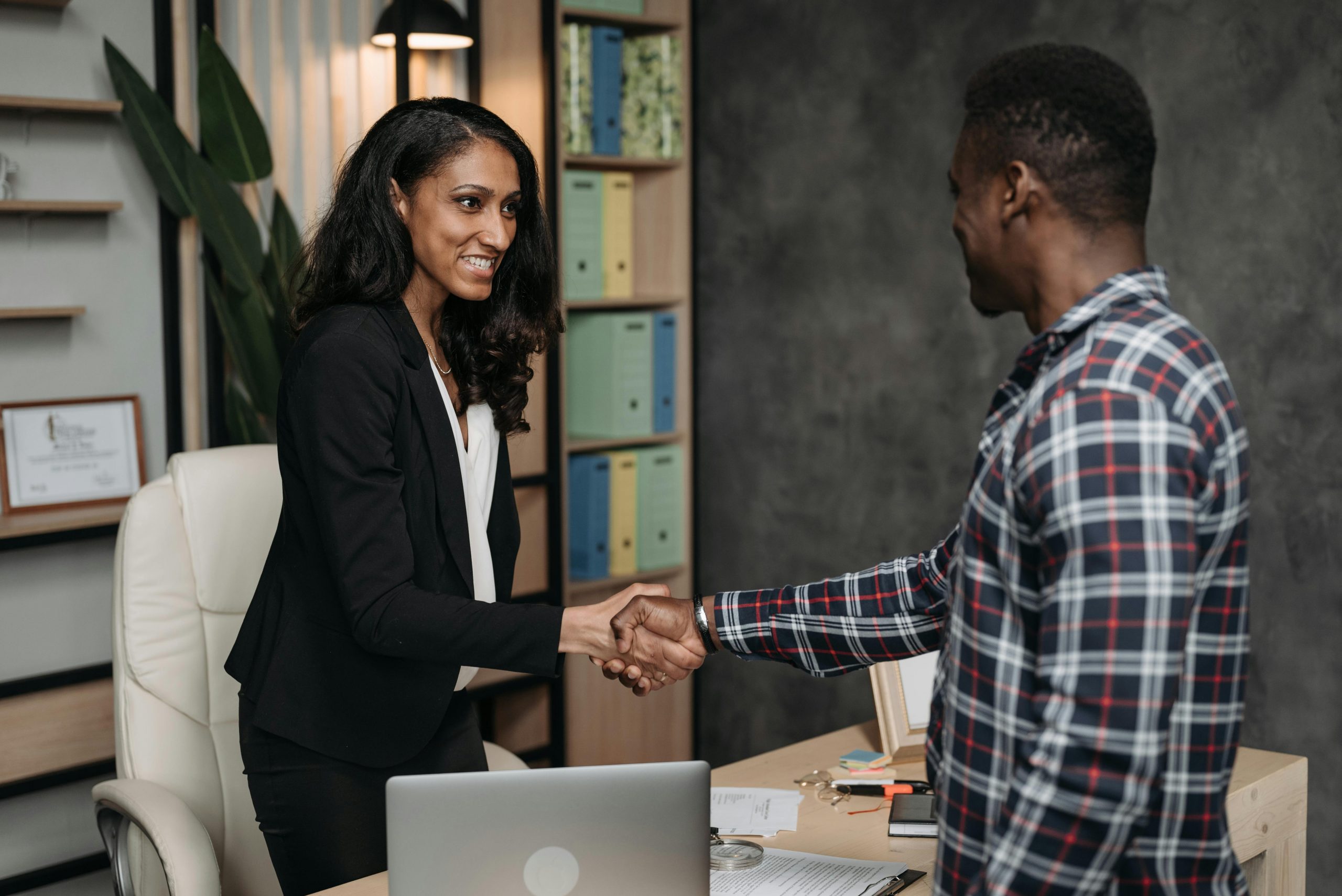 lawyer and her client shaking hands